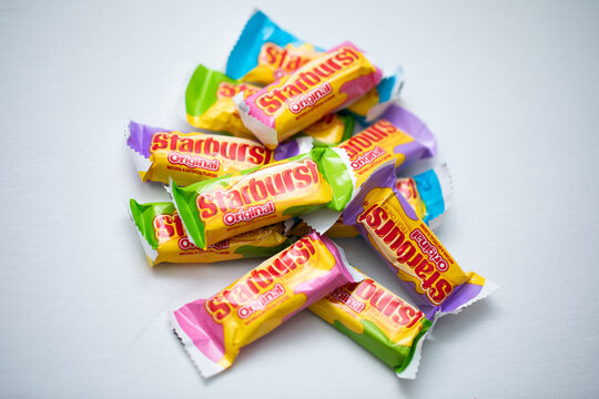 Wrapped Starburst candy on white background