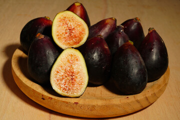 Fresh, ripe dark figs, typical of summer. Sweet, juicy, and natural fruit, perfect for healthy,...