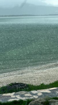 VERTICAL Violent rain and hailstorm on Sevan lake surface