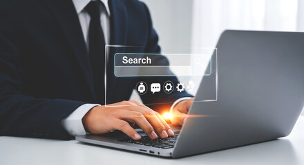 Man in suit typing on laptop with search bar and ai chat settings overlayed on the screen view online