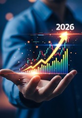 Businessman holding a glowing upward trending financial stock market graph with the year 2026 indicating future growth