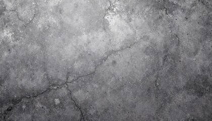 Fototapeta premium A close-up view of a cracked, gray concrete surface, showcasing the texture and imperfections of the material.