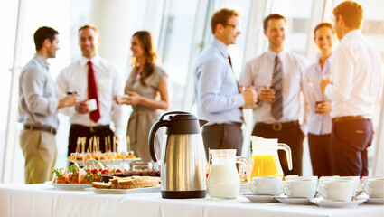 Business people networking during a coffee break at a corporate conference. A team has a positive communication at a professional meeting or event.