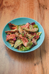 Salad with sauce in a large serving