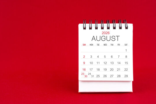 White desk calendar for August 2026 on red color background. - Powered by Adobe