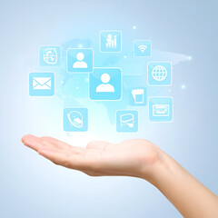 Digital icons appear in a woman's open hand.