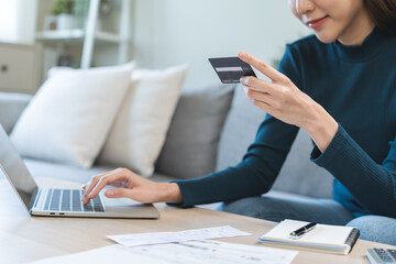 Internet banking, Online shopping at home, asian young woman hand in typing on keyboard, holding...