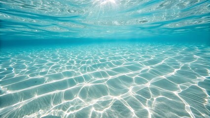 Obraz premium Crystal clear underwater ocean with sunlit sandy bottom