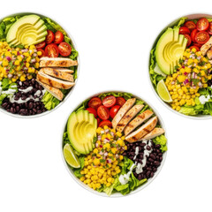 Two to three vibrant Southwest Salad Bowls with grilled chicken, avocado, mango salsa, corn, and black beans on a pure transparent background, shadowless flat lay. Concept of premium commercial food