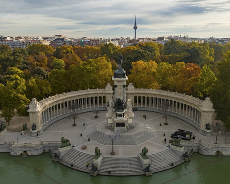 Aerial view of parque el retiro with monumento a alfonso xii surrounded by trees and water, Retiro, Madrid, Spain.