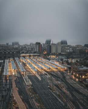 Aerial view of the modern Estacion tren Chamartin with busy railway tracks and city lights at nightfall, Madrid, provincia de Madrid, Spain.