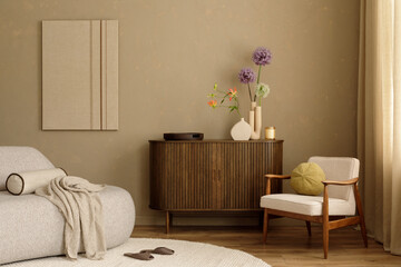 Cozy living room with wooden sideboard, armchair and modern floral arrangement in neutral tones....