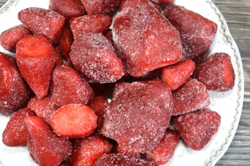 Frozen Strawberry fruit, a widely grown hybrid species of the genus Fragaria in the rose family, Rosaceae, strawberries characterized with its bright red color, juicy texture, and sweetness