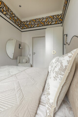 Stylish Bedroom with Floral Border and Modern Mirror