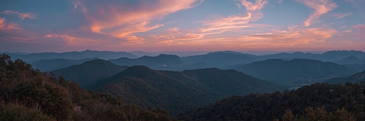 Panoramic view of a mountain range at sunset.
