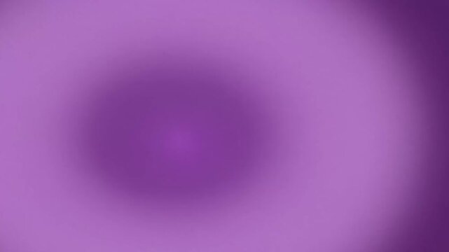 A blurry, circular gradient of purple shades fades from a lighter center to darker edges.