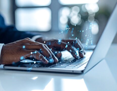 Hands typing on a laptop with digital overlay.