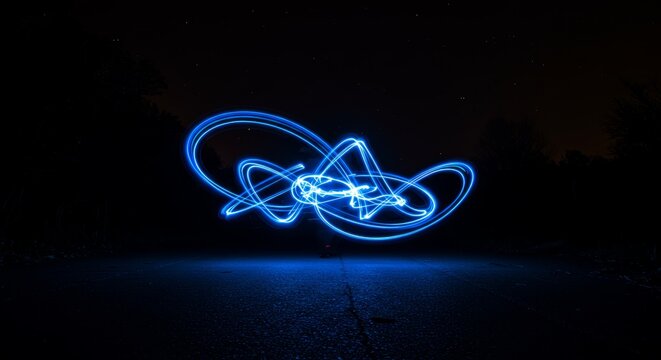 Captivating Abstract Blue Light Streaks Dancing Against the Darkness of Night
