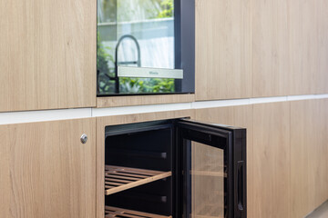 Built-In Wine Fridge in Wood Panel Kitchen