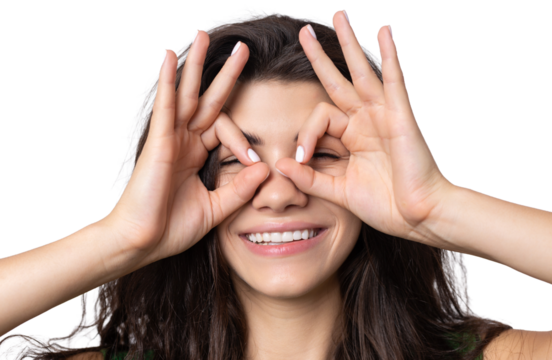 Smiling girl gesturing OK sign with her hand