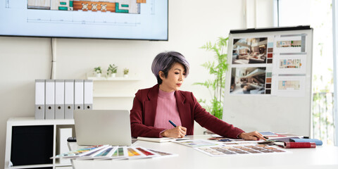 Architect designer Interior creative working hand drawing sketch floor plan selection material color samples art tools Design Studio.