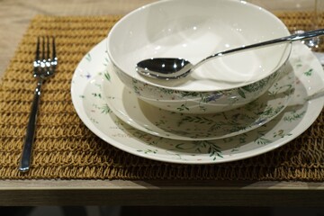 Elegant Floral Dinnerware Set with Utensil on Table