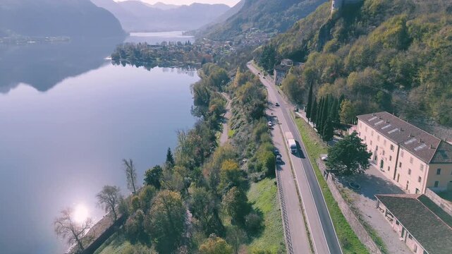 Drone view of a mountain road between Rocca d'Anfo and Lake Idro surrounded by vegetations