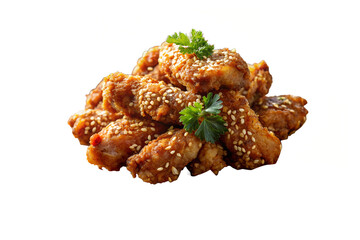 Pile of sesame chicken pieces garnished with parsley on a white background isolated