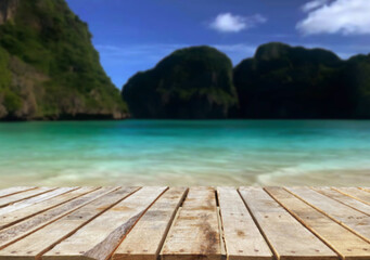 Wooden table top on the beach or sea.Party on the beach  sunshine time concept.For montage product display or design key visual layout.View of copy space.