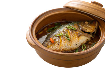 A cooked fish dish with green onions and a red pepper in a brown clay pot with lid slightly open