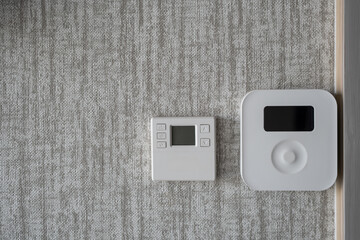 Push button air conditioner remote control. Smart home control panel on apartment wall