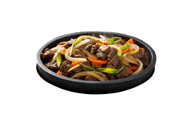 A close up of a stone bowl filled with stir fried beef and vegetables on white background