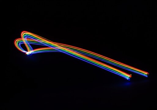 Luminous Rainbow Light Trails Form a Dynamic Heart-Shaped Loop - Powered by Adobe