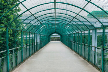 Metal arched frame net guardrails on the pedestrian overpass