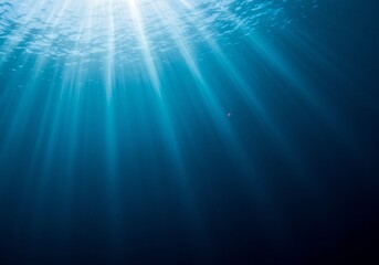 Obraz premium A Lone Pink Jellyfish Adrift in Sun-Kissed Cerulean Depths