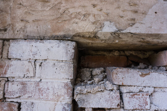 old brick wall with wooden lintel