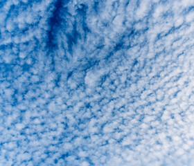 cloudy sky background for wallpaper and design, day skyscape with white beautiful clouds and blue...