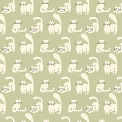 Seamless pattern with cute beige cats on green background &ndash; playful feline vector illustration for textiles, wrapping paper, wallpaper, children&rsquo;s products, pet-themed designs, and creative projects