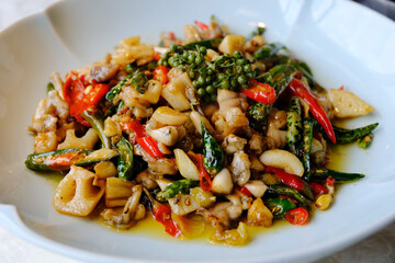 stir-fried bullfrog dish with chili, garlic, and green peppercorns