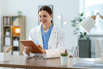 Telemedicine. Doctor having video call with patient via tablet indoors