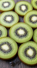 Radiant green kiwi slices creating a mesmerizing organic pattern on rustic wood grain
