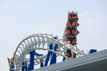 Resort amusement park roller coaster against sky