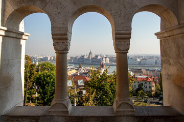City View Framed by Stone Arches Overlooking River and Parliament
