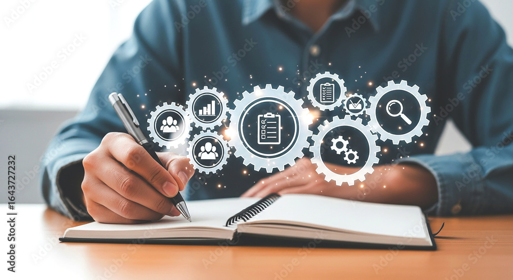 Poster person writing in a notebook with gears and icons floating above symbolizing business processes and 