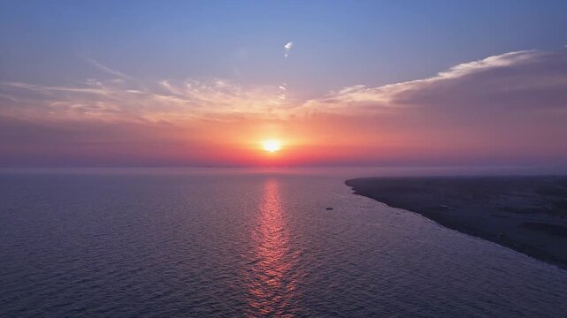 Sunset Over Ocean With Golden Reflection and Distant Shoreline.mov