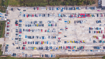 Top view of the parking lot with many cars parked in the lot
