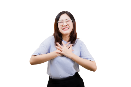 Asian young beautiful woman smiles warmly while holding her hands over her heart, conveying happiness and gratitude. - Powered by Adobe
