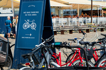 Crowded bike parking despite clear blue No bike parking sign
