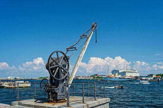 Concrete Harbor with Large Crane and Chains on Sunny Day in Copenhagen CPH harbor