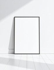Empty black frame on white wall